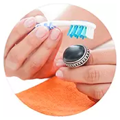 Using a toothbrush to clean jewelry. Using a toothbrush to clean jewelry.